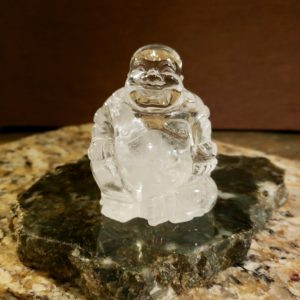 Laughing buddha carved from crystal quartz