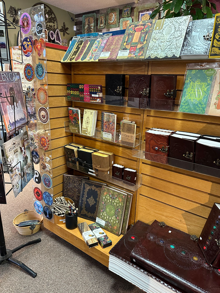 Display of leather-bound journals and stickers