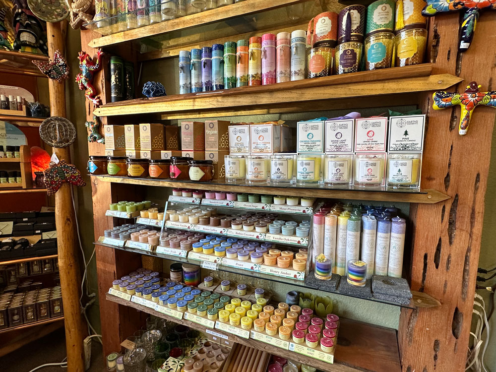 Display of many candles on shelves