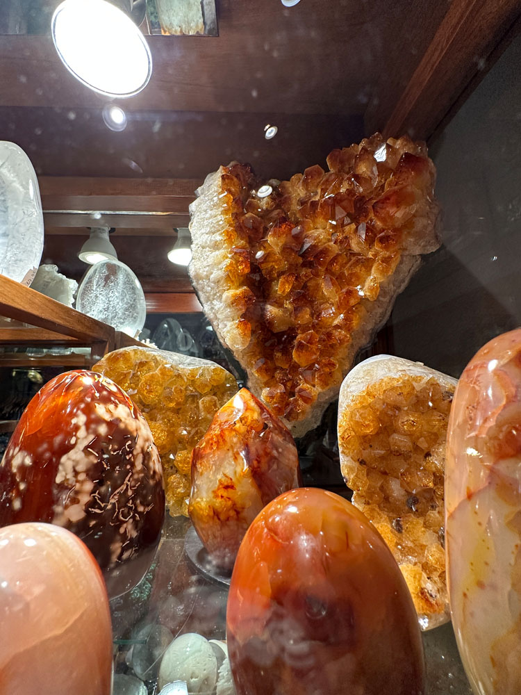 Orange Carnelian Crystals in display case