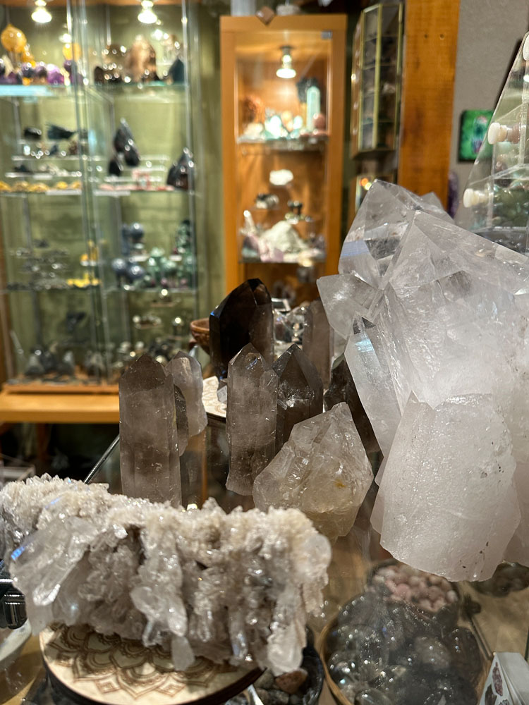 Rock crystal clusters with display cases in background