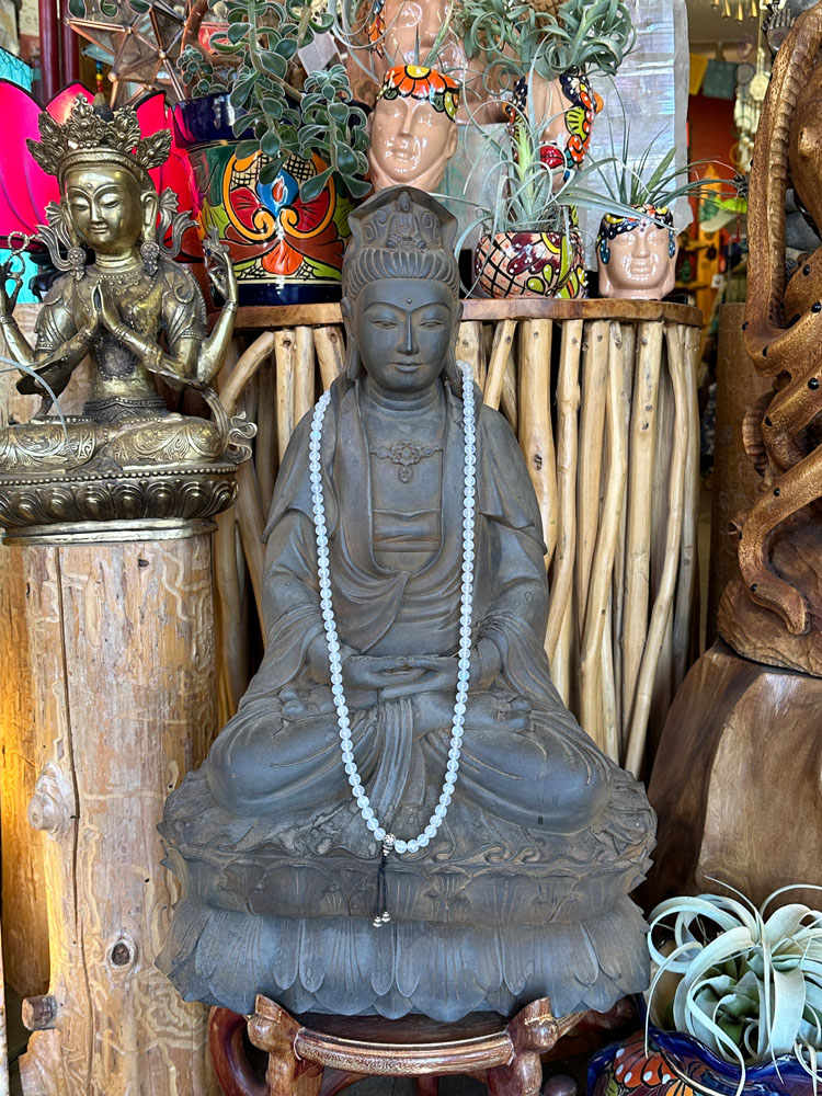 Buddha with bead necklace