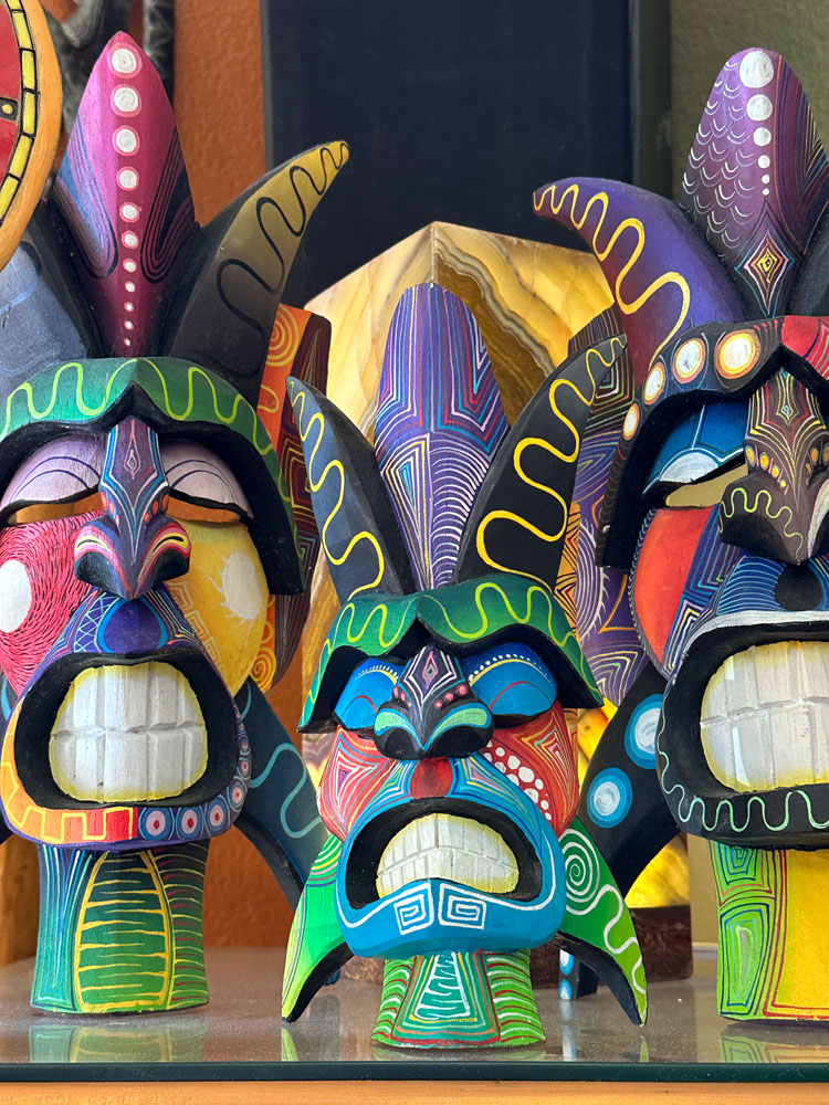 three colorful warrior masks