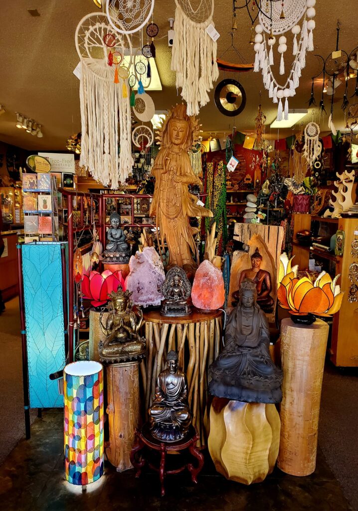 Display of macrame hangings, buddhas and lamps